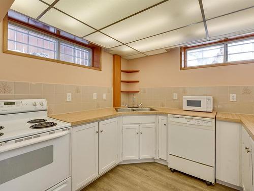 6911 152B Avenue, Edmonton, AB - Indoor Photo Showing Kitchen With Double Sink