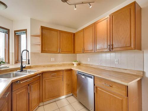 6911 152B Avenue, Edmonton, AB - Indoor Photo Showing Kitchen With Double Sink