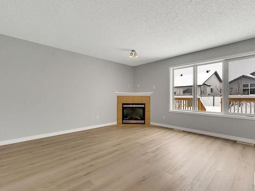 3771 23 Street, Edmonton, AB - Indoor Photo Showing Living Room With Fireplace