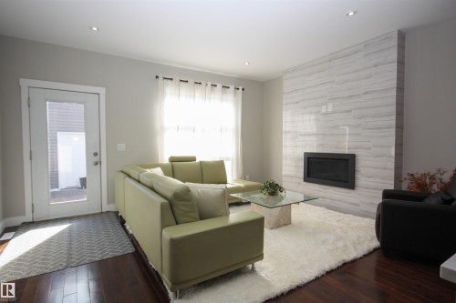 11411 76 Avenue, Edmonton, AB - Indoor Photo Showing Living Room With Fireplace