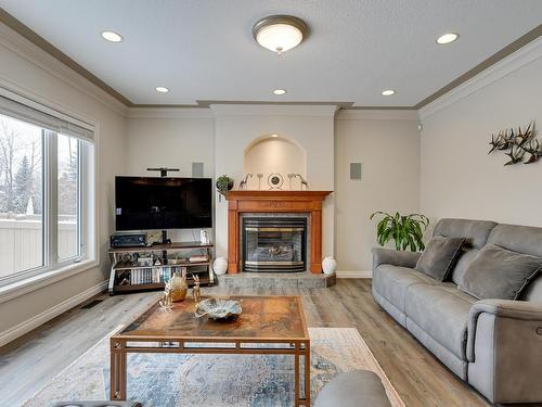 946 Hollingsworth Bend, Edmonton, AB - Indoor Photo Showing Living Room With Fireplace