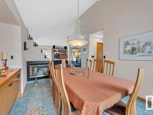 19 Rhatigan Road E, Edmonton, AB - Indoor Photo Showing Dining Room With Fireplace