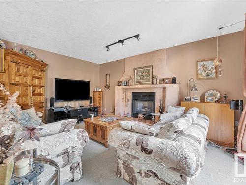 19 Rhatigan Road E, Edmonton, AB - Indoor Photo Showing Living Room With Fireplace