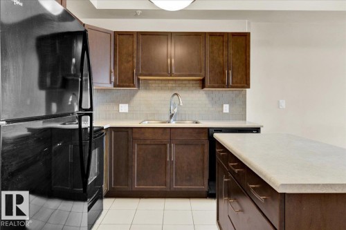 417 4450 Mccrae Avenue, Edmonton, AB - Indoor Photo Showing Kitchen With Double Sink
