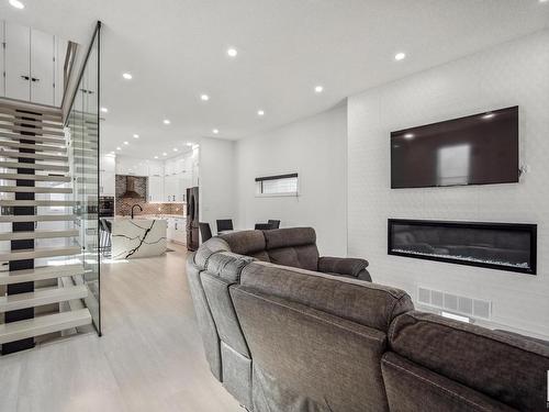 11571 80 Avenue, Edmonton, AB - Indoor Photo Showing Living Room With Fireplace