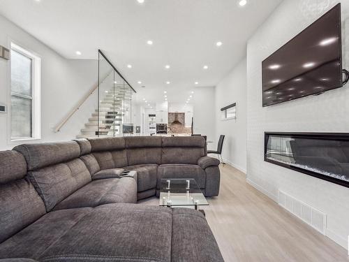 11571 80 Avenue, Edmonton, AB - Indoor Photo Showing Living Room With Fireplace