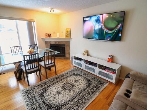 2311 Lemieux Place, Edmonton, AB - Indoor Photo Showing Dining Room With Fireplace