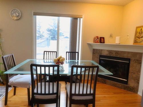 2311 Lemieux Place, Edmonton, AB - Indoor Photo Showing Dining Room With Fireplace