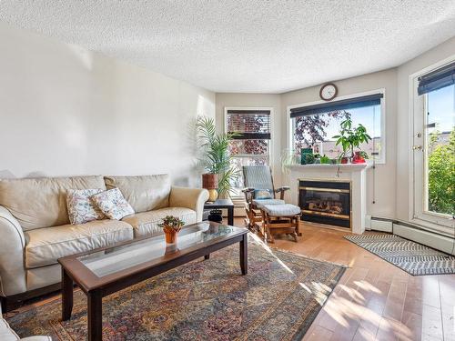 109 10511 42 Avenue, Edmonton, AB - Indoor Photo Showing Living Room With Fireplace