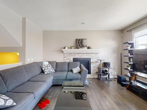 5385 Schonsee Drive, Edmonton, AB - Indoor Photo Showing Living Room With Fireplace