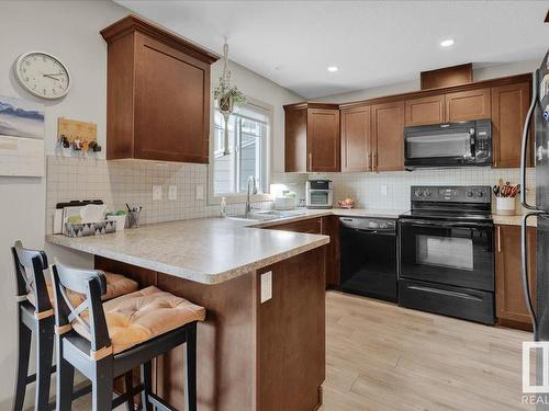 54 1150 Windermere Way, Edmonton, AB - Indoor Photo Showing Kitchen With Double Sink