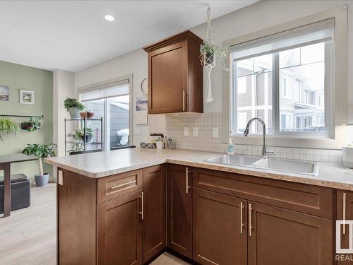 54 1150 Windermere Way, Edmonton, AB - Indoor Photo Showing Kitchen With Double Sink