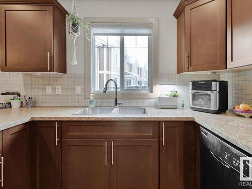 54 1150 Windermere Way, Edmonton, AB - Indoor Photo Showing Kitchen With Double Sink