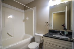 Full bath featuring vanity and shower / tub combo with curtain - 