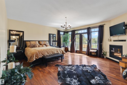 51425 Rge Rd 80, Rural Parkland County, AB - Indoor Photo Showing Bedroom With Fireplace