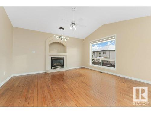 2423 35 Av Nw, Edmonton, AB - Indoor Photo Showing Living Room With Fireplace