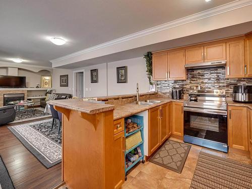 14028 134 Street, Edmonton, AB - Indoor Photo Showing Kitchen With Fireplace With Double Sink