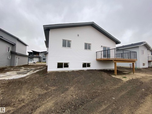 Back of house with a wooden deck - 5417 60 Avenue, Vegreville, AB - Outdoor With Deck Patio Veranda With Exterior
