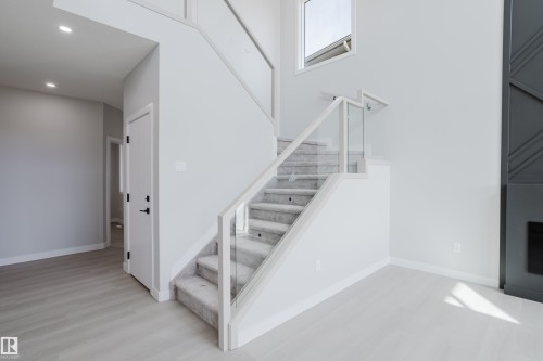147 Caledonia Drive, Leduc, AB - Indoor Photo Showing Other Room With Fireplace
