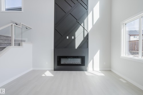 147 Caledonia Drive, Leduc, AB - Indoor Photo Showing Living Room With Fireplace