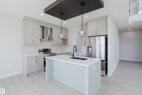 147 Caledonia Drive, Leduc, AB - Indoor Photo Showing Kitchen With Double Sink With Upgraded Kitchen