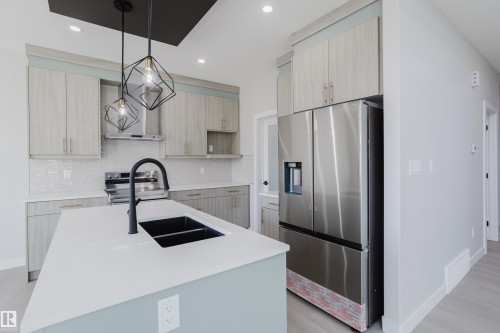 147 Caledonia Drive, Leduc, AB - Indoor Photo Showing Kitchen With Double Sink With Upgraded Kitchen