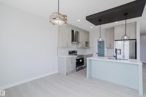 147 Caledonia Drive, Leduc, AB - Indoor Photo Showing Kitchen With Upgraded Kitchen