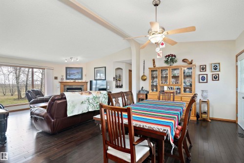 49229 Range Rd 263, Rural Leduc County, AB - Indoor Photo Showing Dining Room With Fireplace