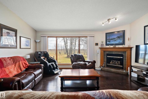 49229 Range Rd 263, Rural Leduc County, AB - Indoor Photo Showing Living Room With Fireplace
