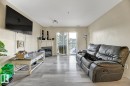 344 2096 Blackmud Creek Drive, Edmonton, AB  - Indoor Photo Showing Living Room With Fireplace 