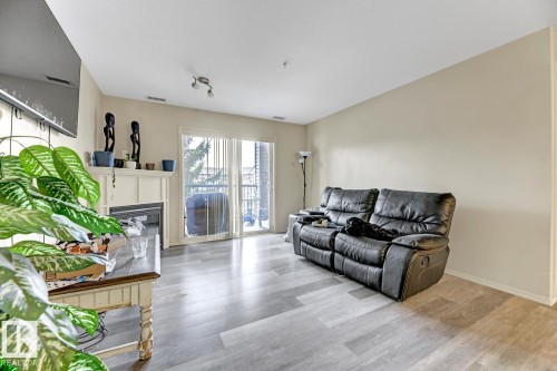 344 2096 Blackmud Creek Drive, Edmonton, AB - Indoor Photo Showing Living Room With Fireplace