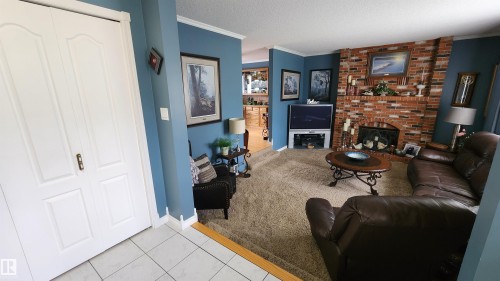5307 Ravine Drive, Elk Point, AB - Indoor Photo Showing Other Room With Fireplace