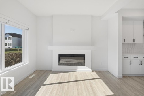 364 Bluff Cove, Leduc, AB - Indoor Photo Showing Living Room With Fireplace