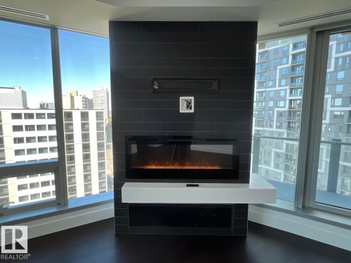 1003 11969 Jasper Avenue, Edmonton, AB - Indoor Photo Showing Other Room With Fireplace