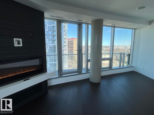 1003 11969 Jasper Avenue, Edmonton, AB - Indoor Photo Showing Other Room With Fireplace