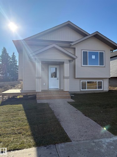View of front of property featuring a front lawn - 7413 44 Avenue, Camrose, AB - Outdoor