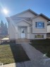 View of front of property featuring a front lawn - 7413 44 Avenue, Camrose, AB  - Outdoor 