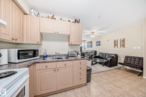 321 8802 Southfort, Fort Saskatchewan, AB - Indoor Photo Showing Kitchen With Double Sink