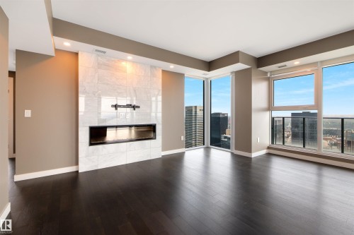3802 10180 103 Street, Edmonton, AB - Indoor Photo Showing Living Room With Fireplace