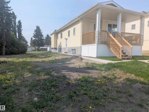 View of property exterior with covered porch and stairway - 4921 50 Avenue, Legal, AB - Outdoor