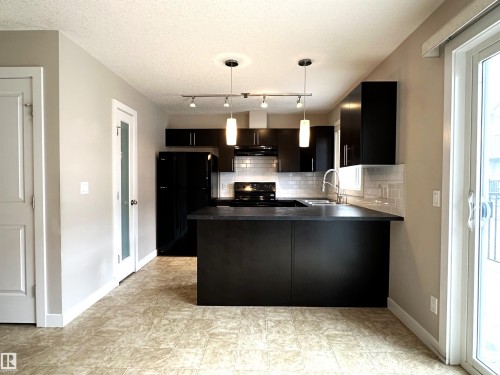 47 9535 217 Street, Edmonton, AB - Indoor Photo Showing Kitchen With Double Sink