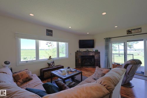 240002 Twp Rd 674, Rural Athabasca County, AB - Indoor Photo Showing Living Room With Fireplace