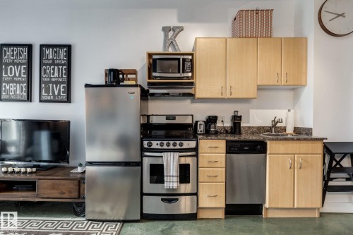 510 10024 Jasper Avenue, Edmonton, AB - Indoor Photo Showing Kitchen With Stainless Steel Kitchen
