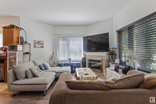 101 8931 156 Street, Edmonton, AB - Indoor Photo Showing Living Room With Fireplace