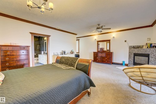2202 28 Street, Cold Lake, AB - Indoor Photo Showing Bedroom With Fireplace