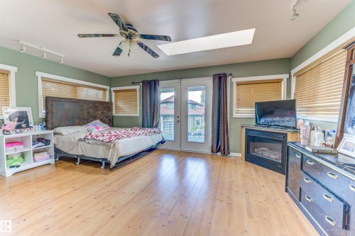 2202 28 Street, Cold Lake, AB - Indoor Photo Showing Bedroom With Fireplace