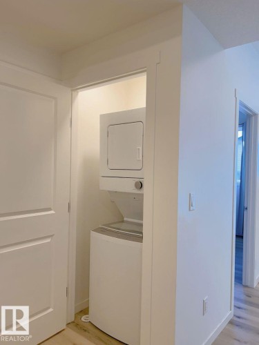202 860 Secord Boulevard, Edmonton, AB - Indoor Photo Showing Laundry Room