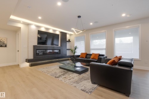 4111 Whispering River Dr. Drive Sw, Edmonton, AB - Indoor Photo Showing Living Room With Fireplace