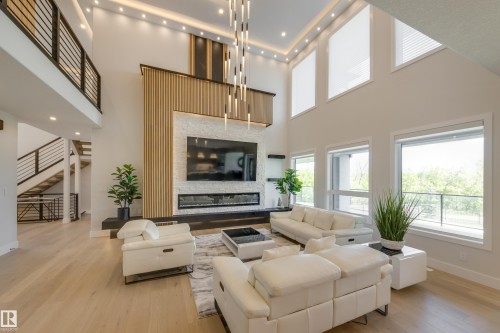 4111 Whispering River Dr. Drive Sw, Edmonton, AB - Indoor Photo Showing Living Room With Fireplace