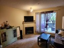 123 2098 Blackmud Creek Drive, Edmonton, AB  - Indoor Photo Showing Living Room With Fireplace 